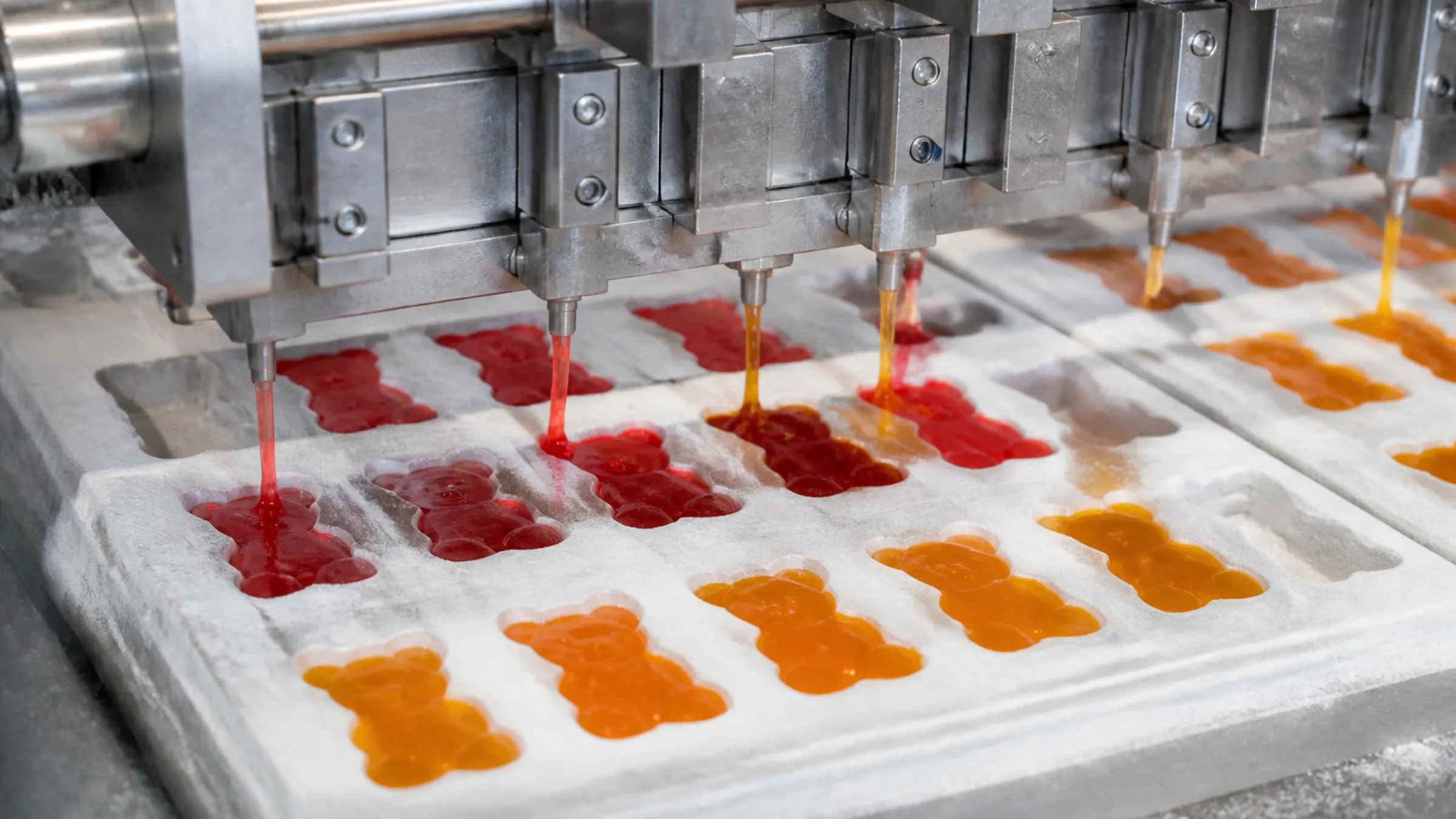 Gummy syrup being cooked in a jacketed stainless steel vessel in the candy kitchen