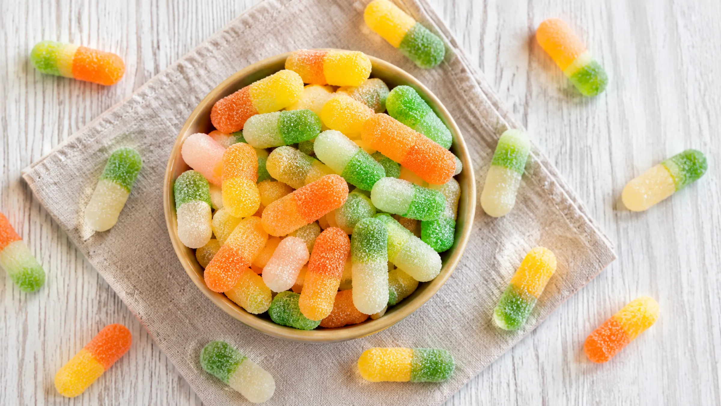 3.Reference sour gummies placed beside a development sample for sourness matching