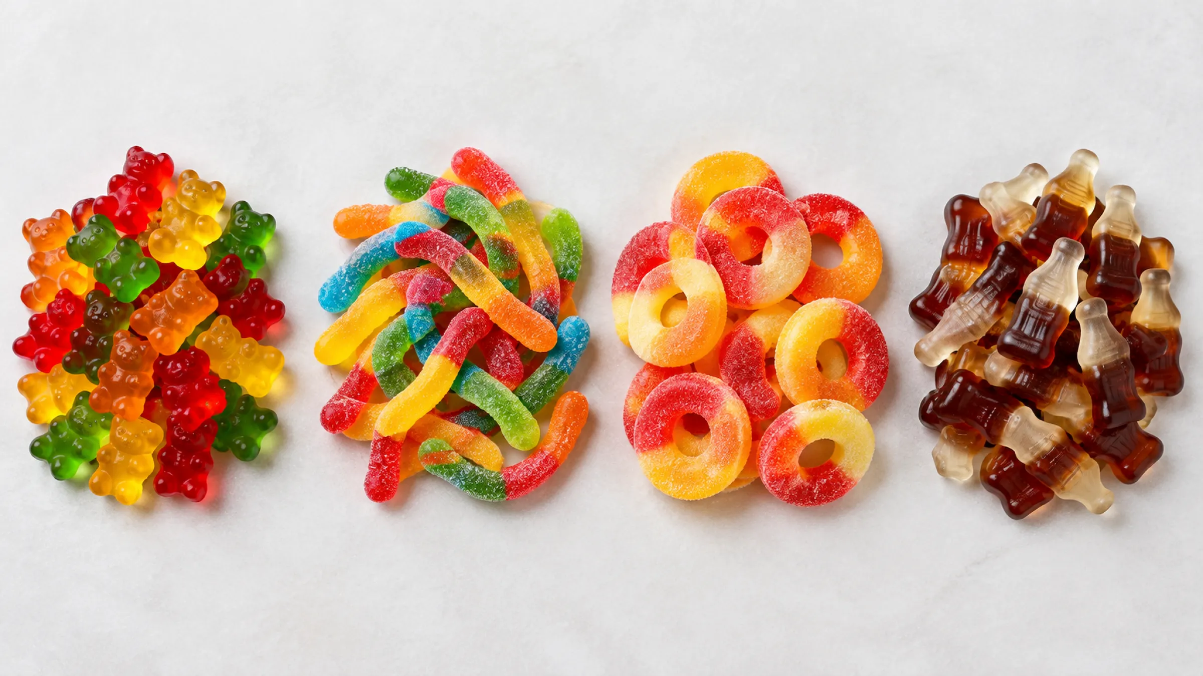 1.Separate piles of gummy bears, worms, rings and cola bottles from a proven product range