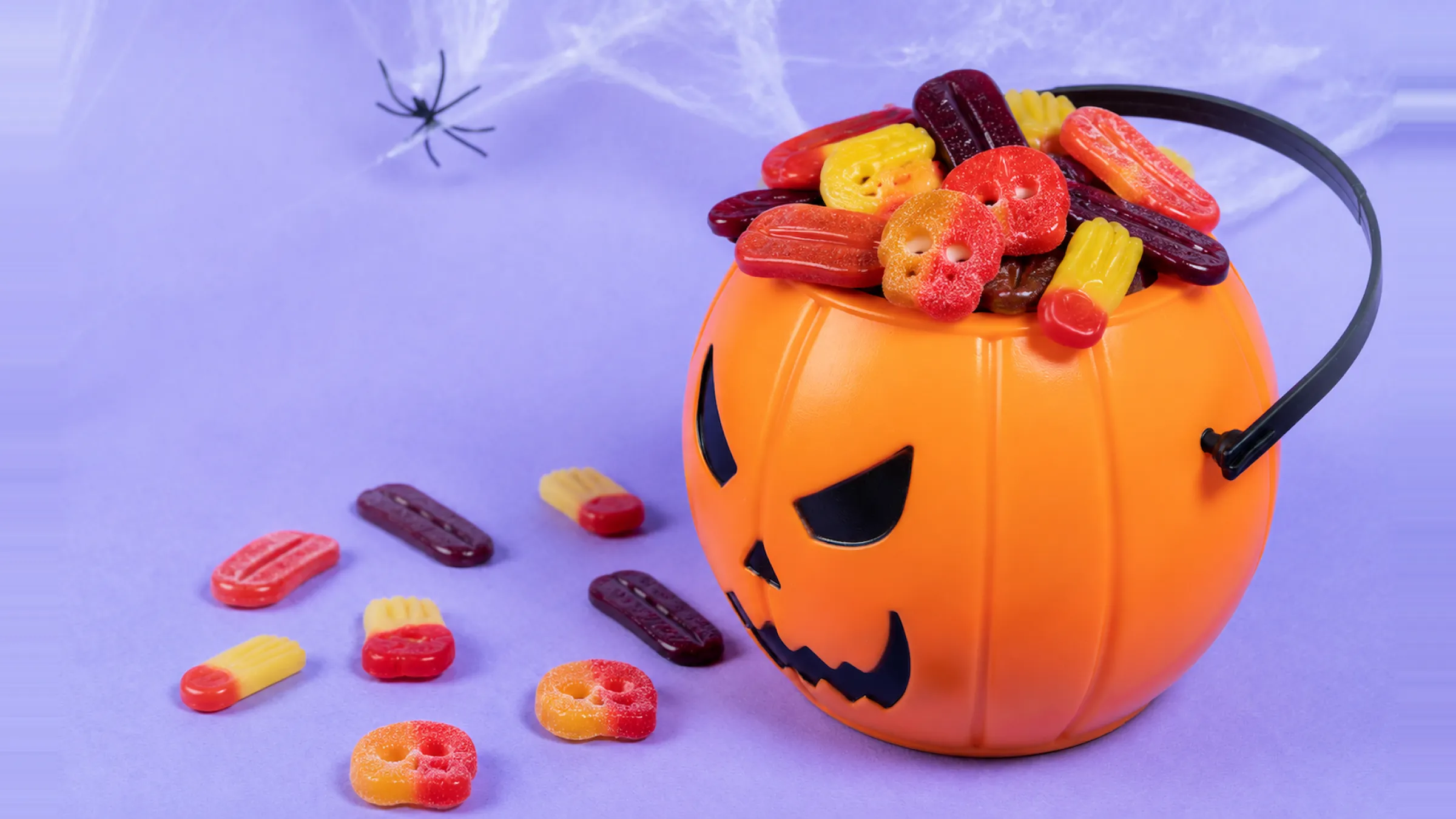 2.Bowl of individually wrapped mini gummy sachets for trick-or-treat
