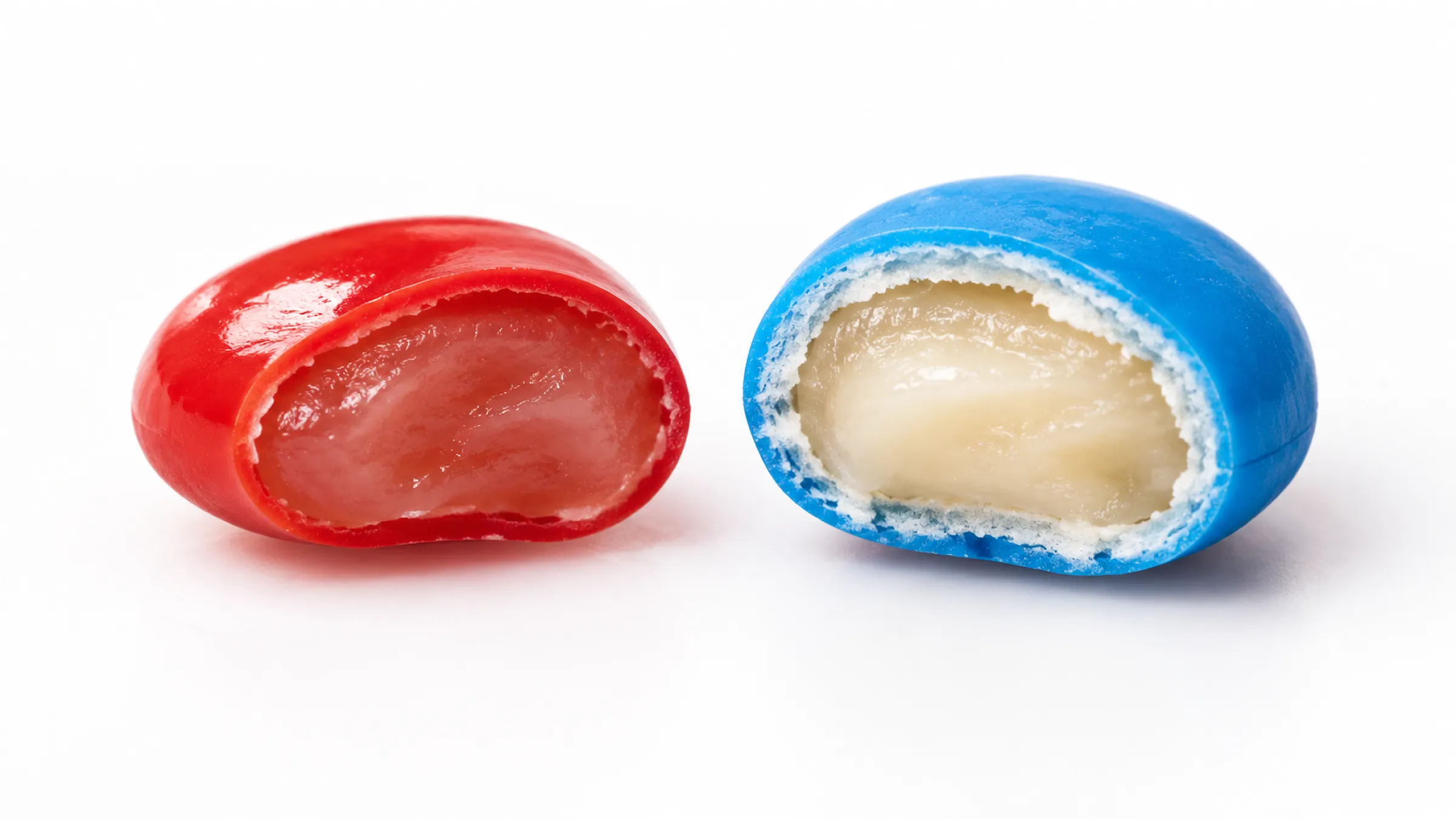 1.Candy beans cut in half showing a thin shell and a thick shell around a chewy center